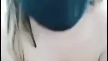 Busty Desi whore strips slowly and sticks fingers into her XXX ass