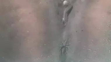 Tattooed Indian slut plays with her boobs and dark cunt underneath the water while in the bathtub