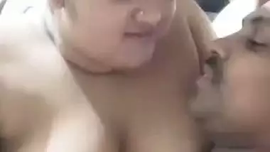 Chubby wife soft boobs pressed against husband in foreplay
