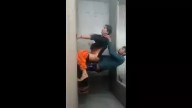 It looks like an amateur Indian couple is having sex on the wall