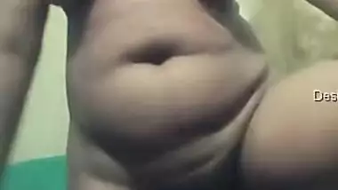 Amateur Indian woman goes in bathroom to show her XXX jugs and muff