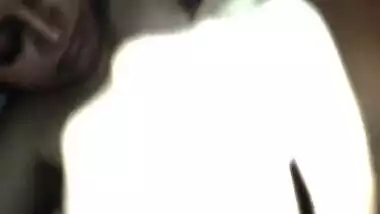 Indian slut lies in bed while XXX boyfriend has oral sex with her